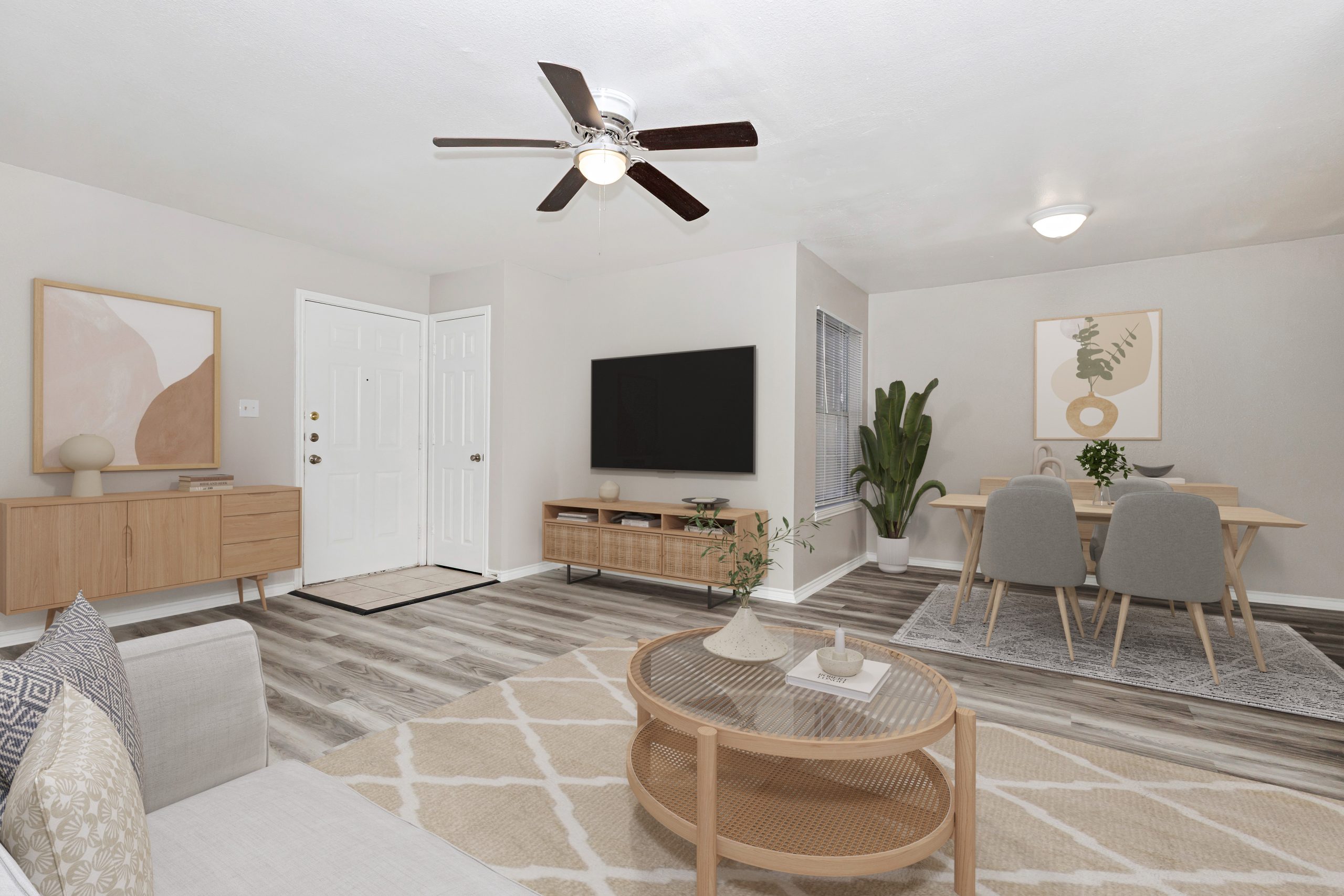 a living room filled with furniture and a tv