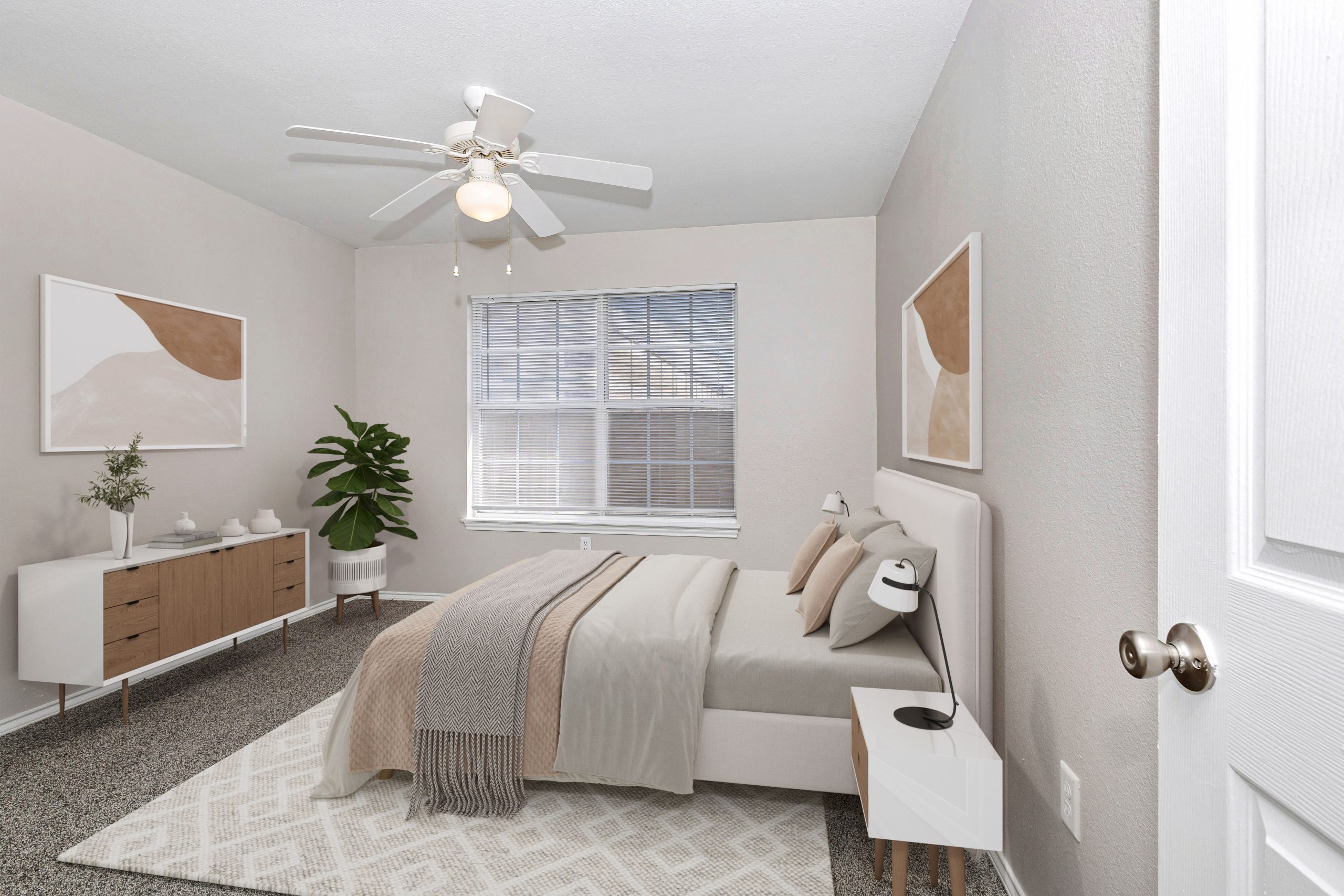 a bedroom with a bed and a dresser